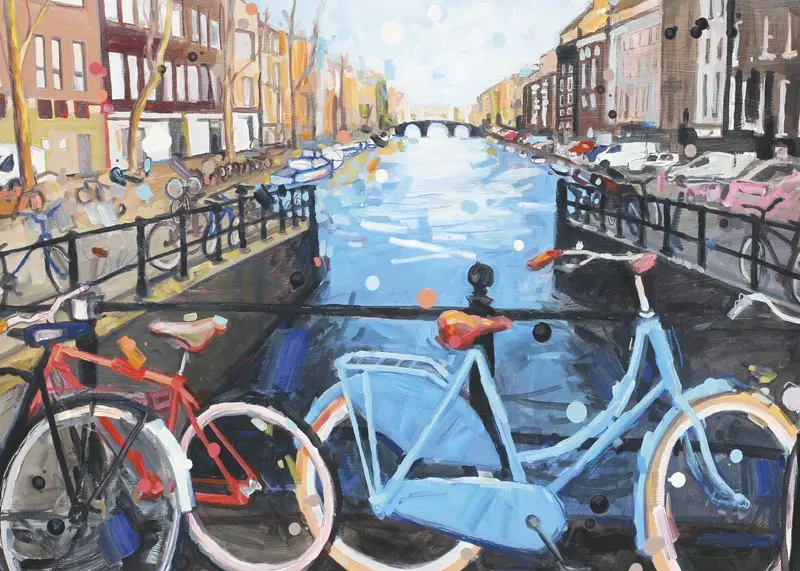 a painted red and blue bike parked on a bridge on a canal in Amsterdam