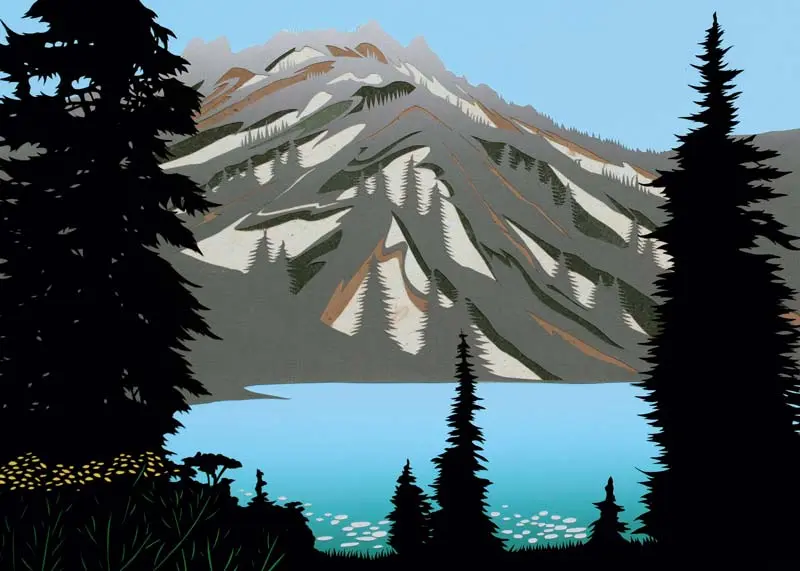 Landscape of a forested mountain with a lake